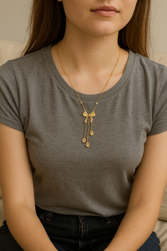Gold-Tone Ribbon Drop Pendant Necklace – Graceful & Elegant